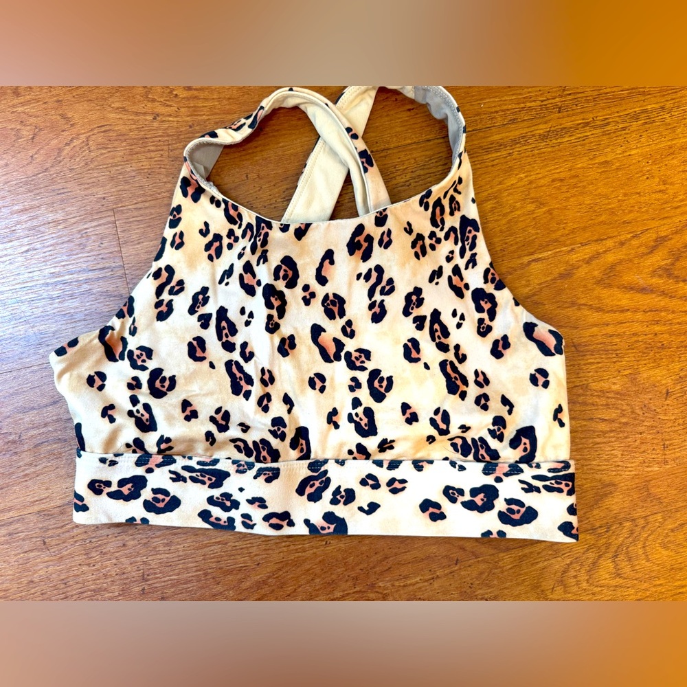 FABLETICS animal print cross back racer back style size medium sports bra.